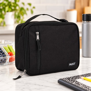 Suggested SEO alt text:  PackIt Freezable Classic Lunch Box in Black with built-in EcoFreeze™ cooling technology and spacious insulated interior for packed lunches.