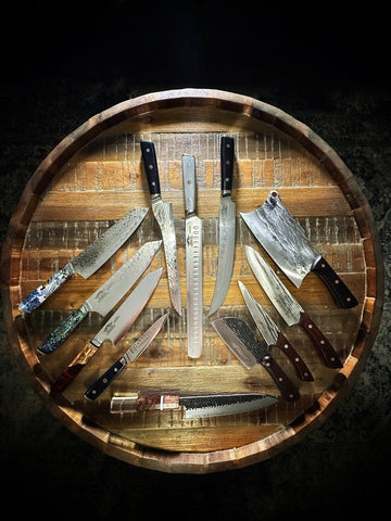 Collection of kitchen knives on a wooden board